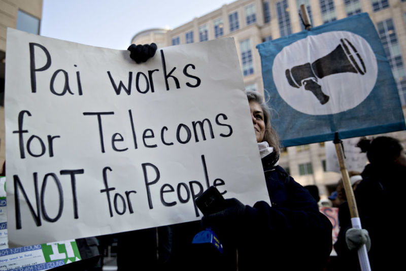 Net neutrality supporter holds a sign outside FCC on Dec. 14, 2017, before vote to repeal net neutrality rules.