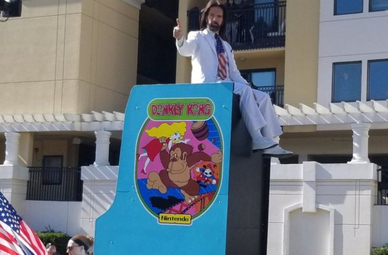 Mitchell rides an oversized <em>Donkey Kong</em> machine in the Citrus Bowl parade.