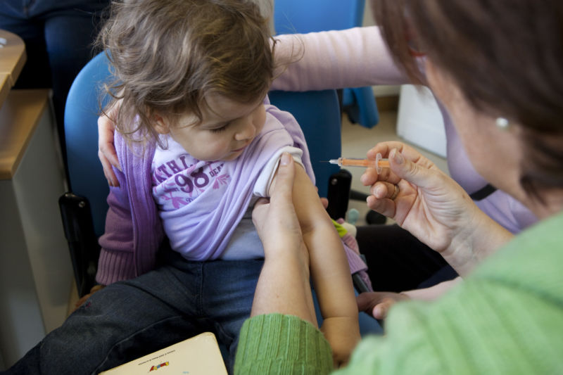 A child received a vaccination against influenza A (H1N1).