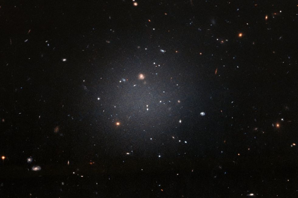 The recently discovered galaxy is so diffuse that you can see other, more distant galaxies right through it.