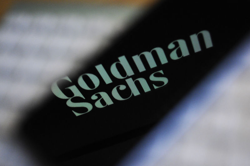 The Goldman Sachs bank logo is seen reflected on the screen of a mobile phone in this photo illustration on November 15, 2017.