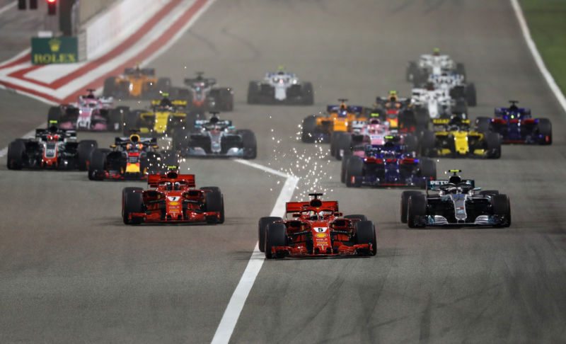 Sebastian Vettel of Germany driving the (5) Scuderia Ferrari SF71H leads Kimi Raikkonen of Finland driving the (7) Scuderia Ferrari SF71H, Valtteri Bottas driving the (77) Mercedes AMG Petronas F1 Team Mercedes WO9 and the rest of the field at the start during the Bahrain Formula One Grand Prix at Bahrain International Circuit on April 8, 2018 in Bahrain, Bahrain. 