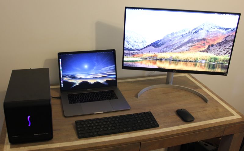 A MacBook Pro with an eGPU enclosure and an external monitor.