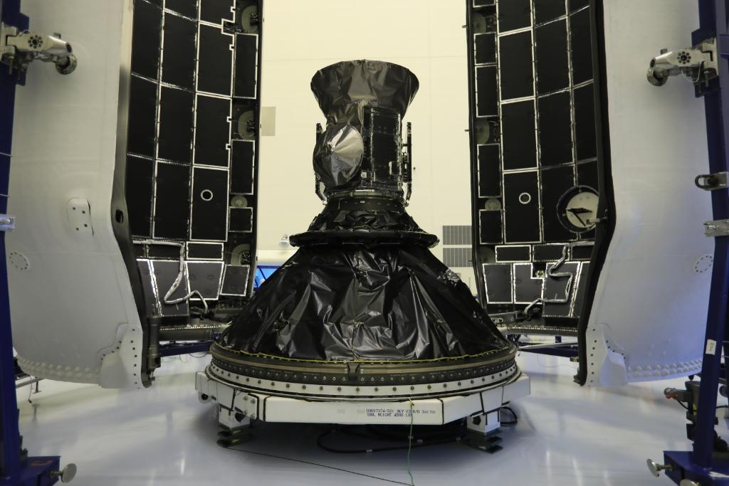 The small, refrigerator-sized TESS spacecraft inside the Falcon 9 rocket payload fairing. 