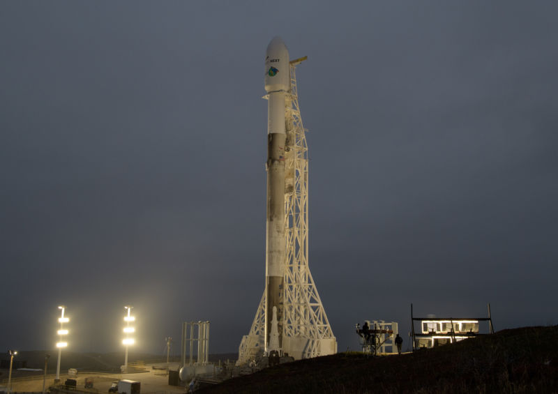 A sooty Falcon 9 rocket is ready for launch at Vandenberg Air Force Base in California.
