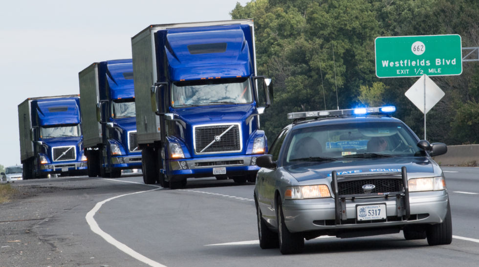 The US Federal Highway Administration conducts demonstrations of partially automated semi-truck platoons September 14, 2017, as three specially equipped Volvo semi-trucks cruise in Centreville, Virginia, with a Virginia State Trooper escort. 
