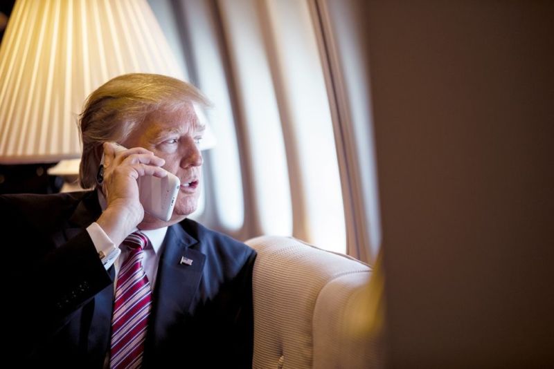 President Donald Trump talks on an iPhone with a Morphie battery pack aboard Air Force One on January 26, 2017. (Official White House Photo by Shealah Craighead.) Hat tip to Ron Amadeo for identifying the phone.