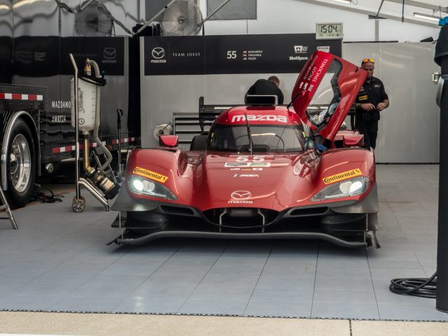 A Mazda DPi race car in the garage