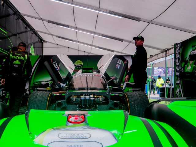A Tequila Patron ESM Nissan race car in the garage