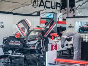 A Penske Acura race car in the garage