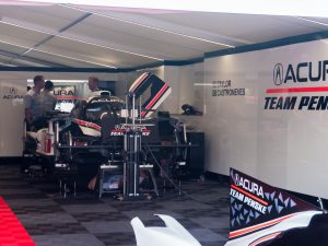 A Penske Acura race car in the garage