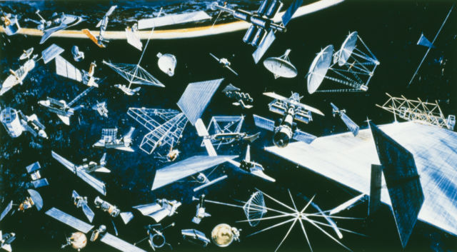 Artist's impression depicting a wide variety of existing and future satellites for communication, surveying Earth resources, and mapping them, circa 1978.