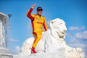 DETROIT, MI - JUNE 3: Ryan Hunter Reay #28 of Andretti Autosport, winner of the Chevrolet Dual in Detroit, part of the Verizon Indy Car Series, sits on the marble lion in the Chevrolet Fountain after the 2018 Chevrolet Detroit Grand Prix at Belle Isle on June 3, 2018 in Detroit, Michigan.