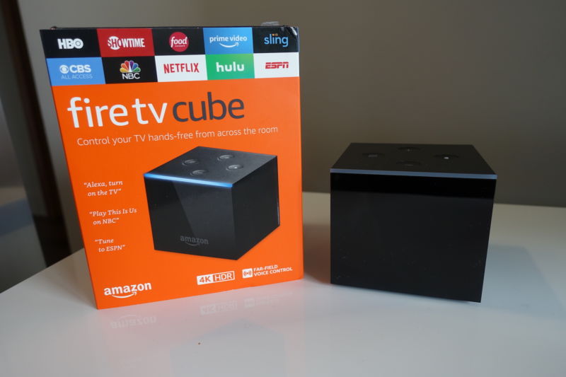 The Fire TV Cube is a small Fire TV with an Echo Dot baked into it. It has a shiny black finish around the sides, with a matte black top.