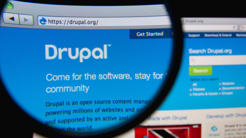 Screenshot of Drupal.org as seen through magnifying glass.