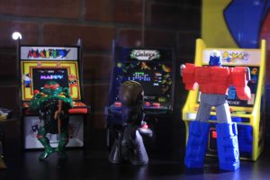 Action figures play tiny arcade cabinets