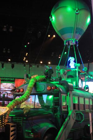 The battle bus floats above the Fortnite booth