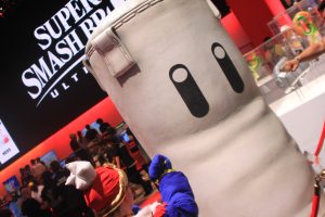 An attendee punches a dummy