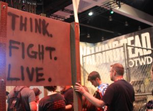 A sign reading Think. Fight. Live.