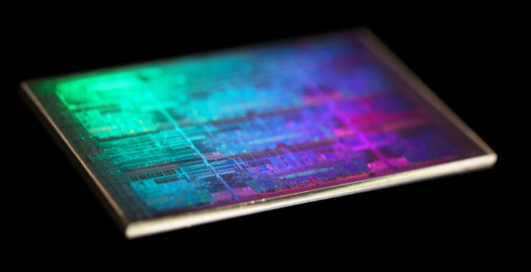 Extreme closeup photography of a computer chip on a black background.