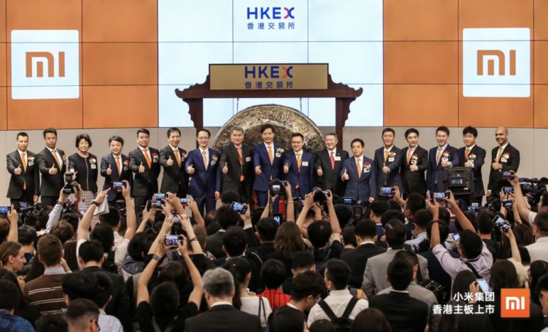 Men in suits pose for a picture.