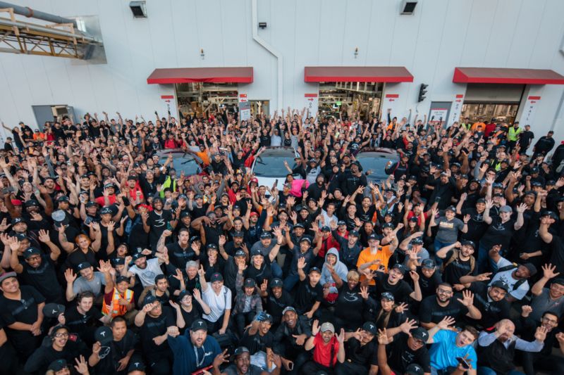 Tesla workers celebrate a record production quarter.