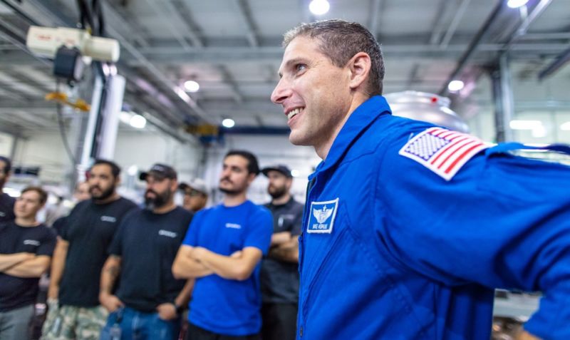 NASA astronaut Mike Hopkins meets with employees at SpaceX on Monday.