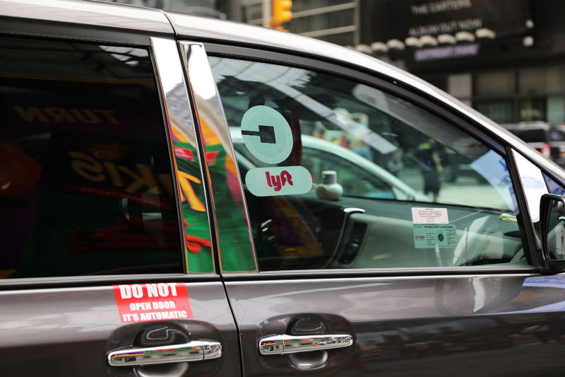 A Lyft ride-hailing vehicle moves through traffic in Manhattan on July 30, 2018 in New York City.