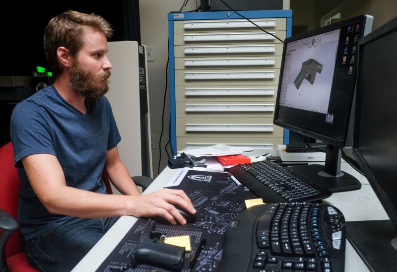 Ben Chalker, who is in charge of manufacturing at Defense Distributed, shows a part of the blueprint on a computer at the Austin, Texas, factory on August 1, 2018. 