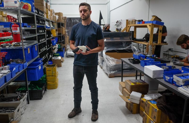 Cody Wilson, owner of Defense Distributed company, holds a 3D printed gun, called the "Liberator", in his factory in Austin, Texas, on August 1, 2018.