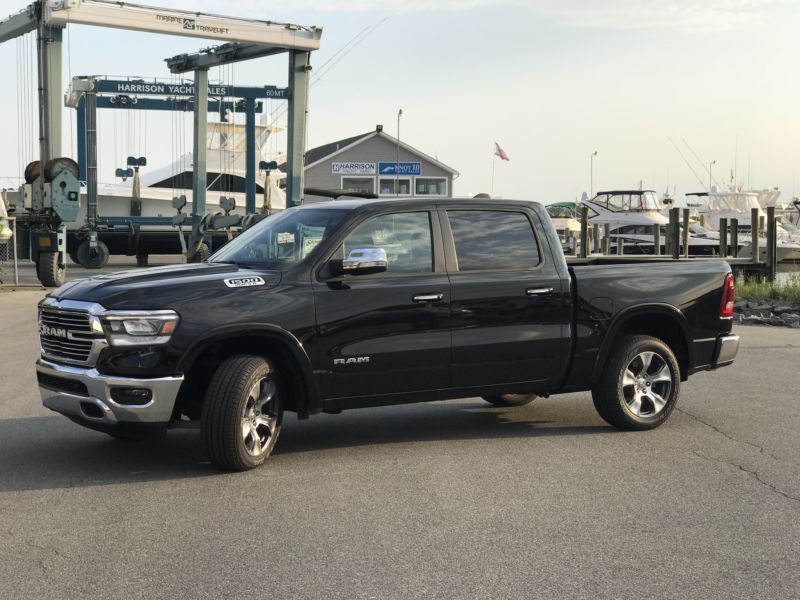 A 2019 Dodge Ram sits in an industrial parking lot.