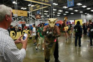 Cosplay of a pig with a chainsaw