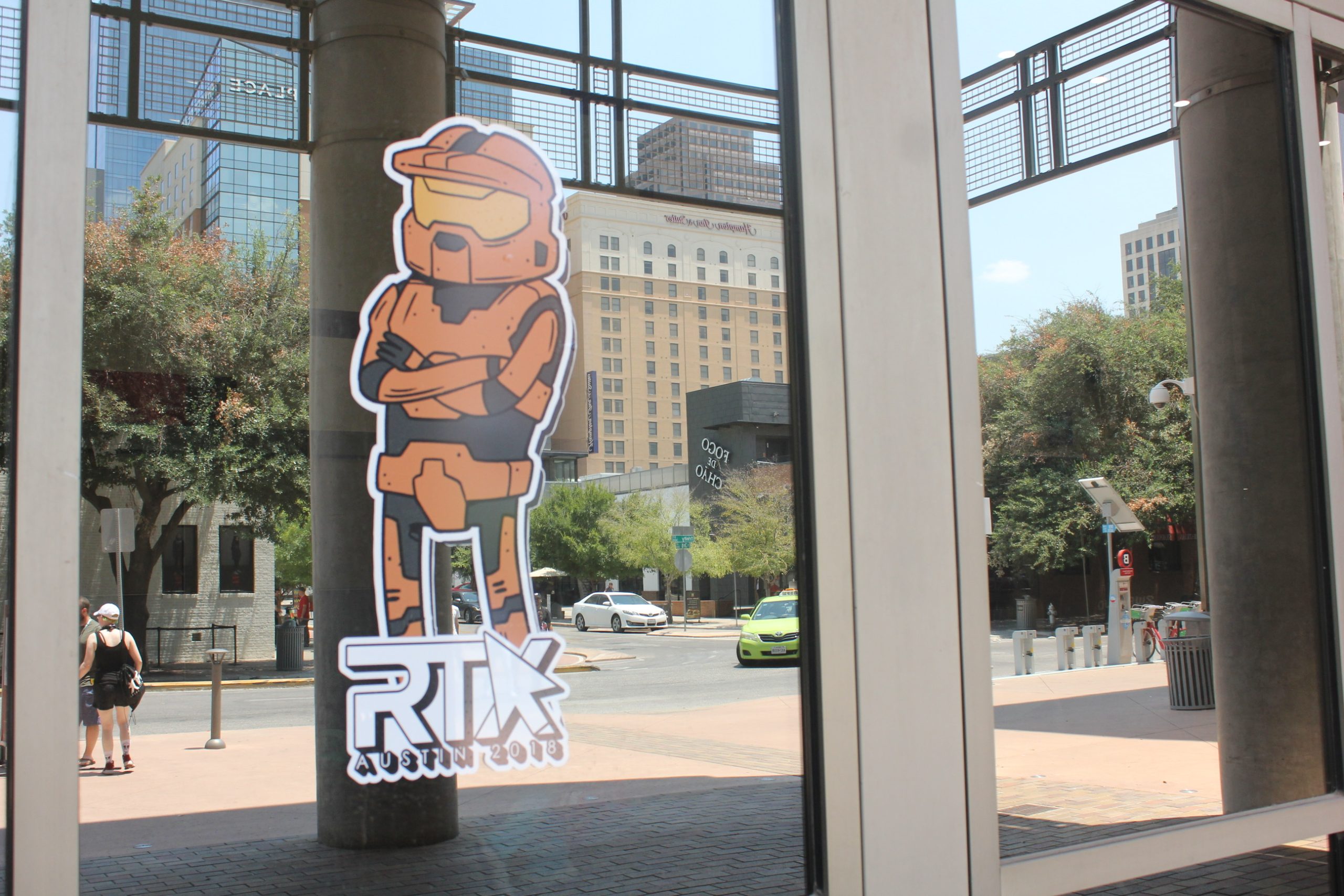 The RTX Austin logo prominently features a red Halo player