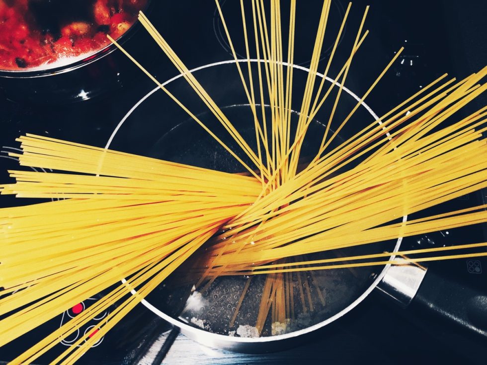 A bowl of uncooked spaghetti.