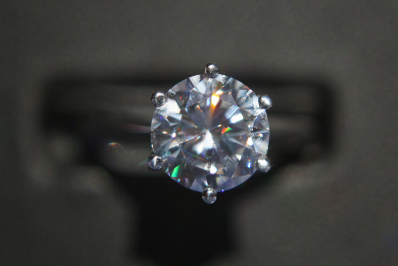 Close up of a diamond mounted on a ring.