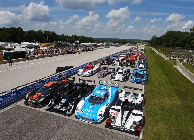 In anticipation of next year's merger, cars form the American LeMans Series and Grand-Am line up for a group shot at Road America on August 9, 2013
