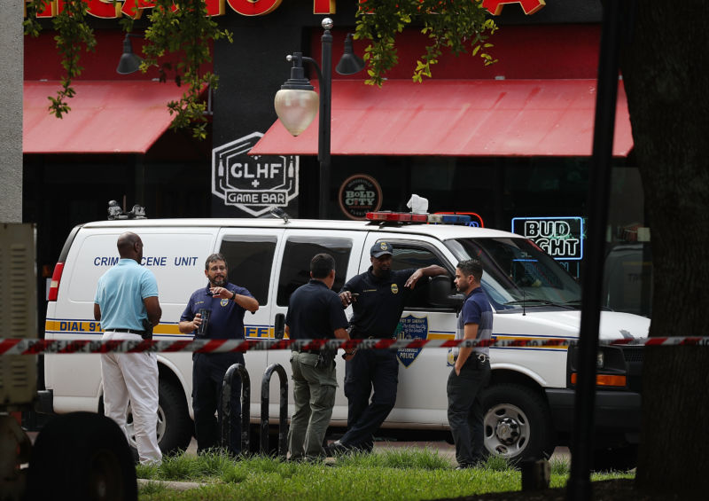 Law enforcement officials investigate a shooting in the GLHF Game Bar where three people including the gunman were killed at the Jacksonville Landing on August 26, 2018 in Jacksonville, Florida. 