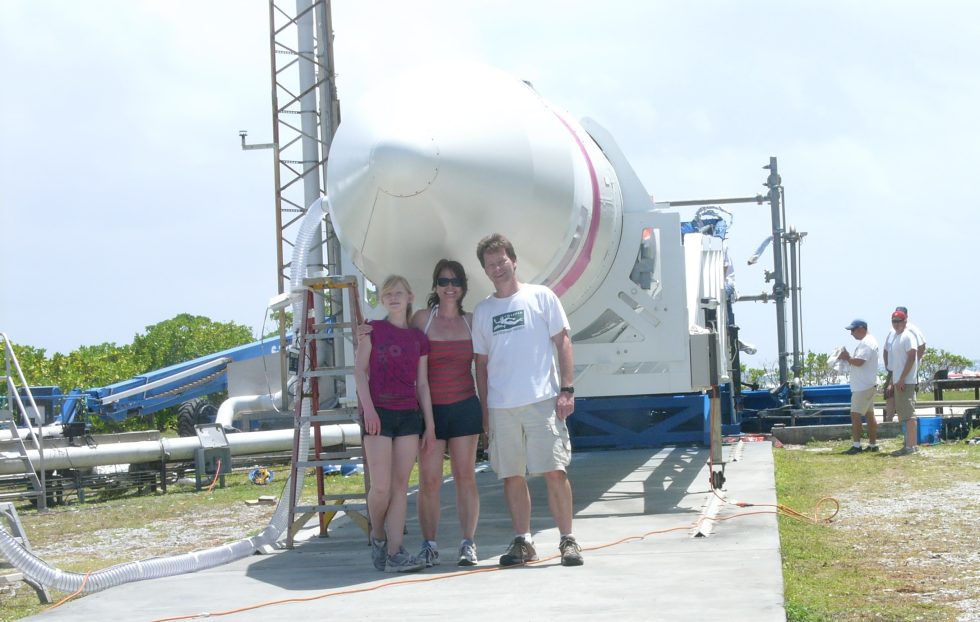 Hans Koenigsmann with his family, and the Falcon 1 rocket, at Omelek.