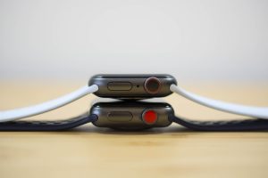 An Apple Watch Series 4 on top of an Apple Watch Series 3.