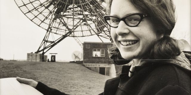 A young Jocelyn Bell with the radio telescope array she helped build at Cambridge.