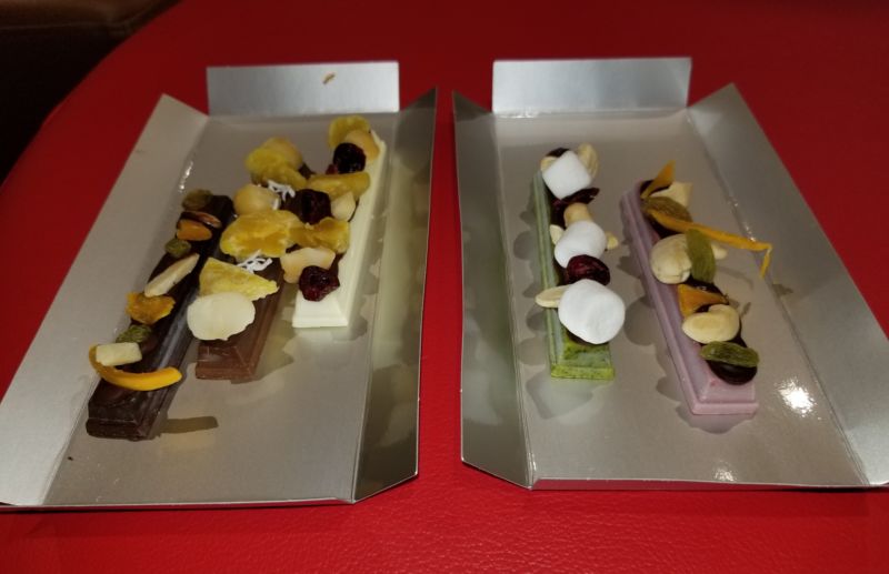 My custom Kit Kat order: dark chocolate, milk chocolate, white chocolate, matcha, and "ruby" bars, from left to right, all covered with freeze-dried toppings.