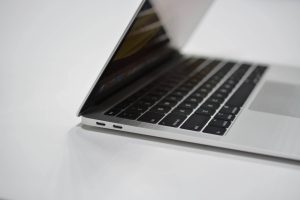 The 2018 MacBook Air sitting on a white table.