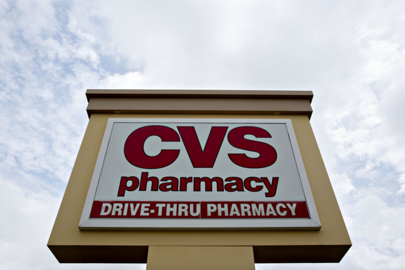 Signage stands outside a CVS Health Corp. store in Rock Island, Illinois, U.S., on Tuesday, Aug. 7, 2018.