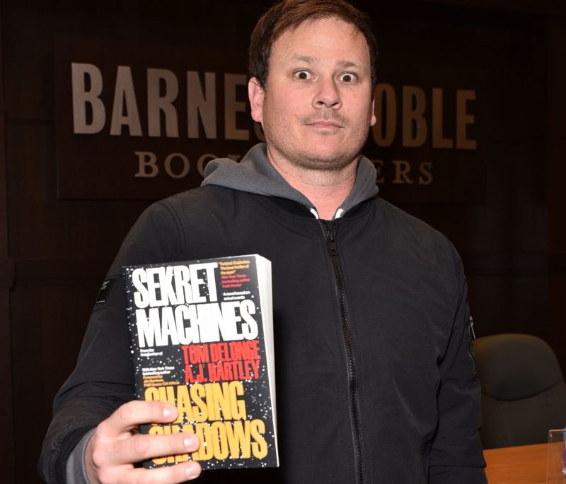 Tom DeLonge with one of his new novels about "The Phenomenon."