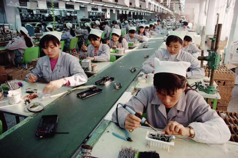 Women soldering components at a factory in Shenzhen, Guangdong Province, China.