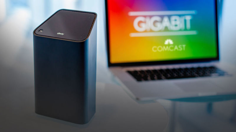 Promotional image of a smart speaker near a laptop computer.