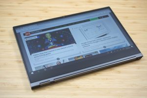 Lenovo's Yoga C930 2-in-1 on a wooden table.
