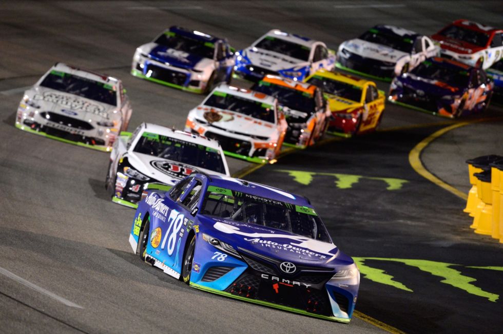 Martin Truex Jr. leads a pack of cars during the Monster Energy NASCAR Cup Series Federated Auto Parts 400 at Richmond Raceway on September 22, 2018 in Richmond, Virginia.