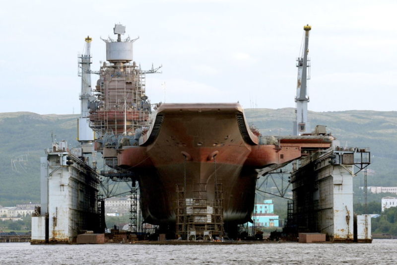 MURMANSK, RUSSIA - Russian aircraft carrier <em>Admiral Kuznetsov</em> at the PD-50 floating dry dock of Shipyard 82.