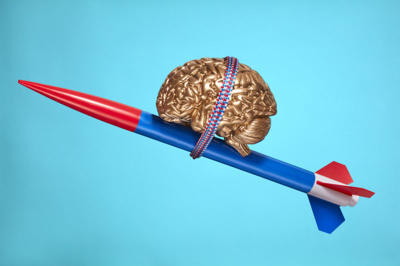 "A model brain atop a rocket symbolizes innovation, progress, and psychology topics." Thanks, Getty Images!